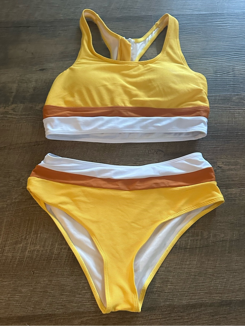 Amazon Women's Yellow Two-Piece Bikini with White and Brown Trim